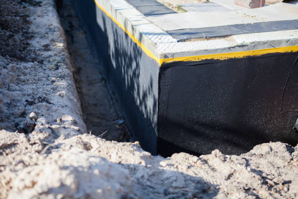 Professional Waterproofing technician working in Rothschild, WI